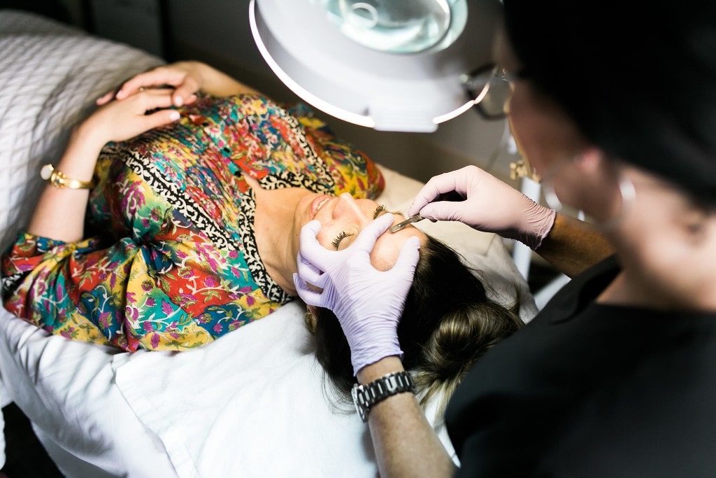 Woman getting the dermaplaning procedure